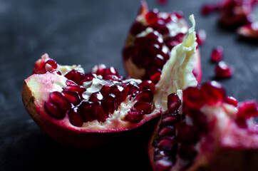 Red pomegranate on dark background