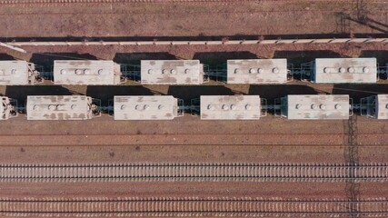 Railway hub showing old crusty freight cars , trains on tracks next to each other top down view drone moving railway tracks positioned parallel. Old Railway Carriages and Wagons 