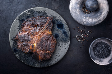 Modern style traditional barbecue dry aged wagyu porterhouse beef steak bistecca alla Fiorentina...