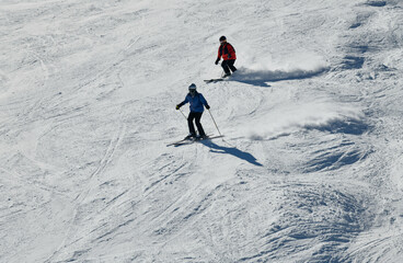 Fototapeta na wymiar People skiing on snowy hill at Breckenridge ski resort. Extreme winter sports. Action shot. Breckenridge, CO