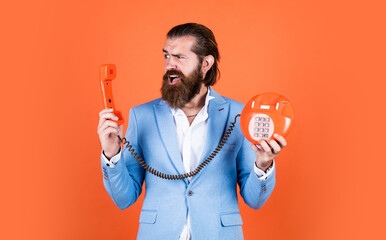 bearded man in formalwear speak on retro phone. elegant businessman has business talk....