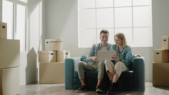 Couple holds apartment outline in hands and plan renovation