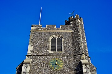 Church clock tower with blue sky background