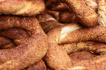 Selective focus fresh Turkish street food Simit. Bagel simit selling. Bagel with sesame, close up.
