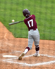 Action photo of high school baseball players making amazing plays during a baseball game