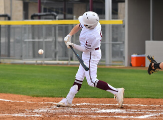 Action photo of high school baseball players making amazing plays during a baseball game