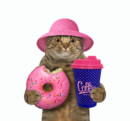 A beige cat in a straw hat holds a pink donut and a blue cup of coffee. White background. Isolated.