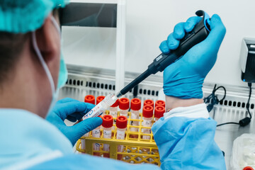 The PCR tester takes a sample analysis from a test tube
