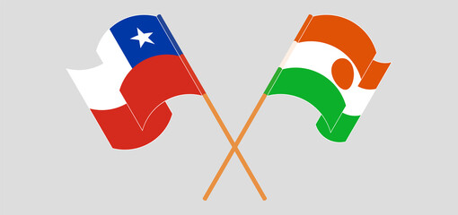 Naklejka premium Crossed and waving flags of Chile and Niger