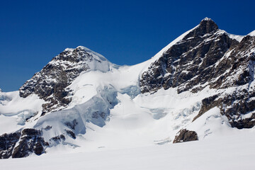 The Jungfrau and its neighbour, the Rottalhorn, from the Jungfraufirn Glacier, with the Rottalsattel between: Bernese Oberland, Switzerland