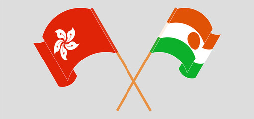 Crossed and waving flags of Hong Kong and Niger