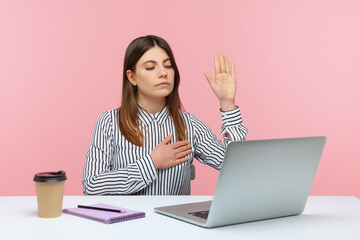 I swear! Responsible woman office worker giving promise holding hand on heart, looking at laptop...