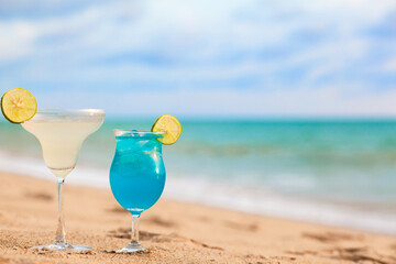exotic coctails over beach background. Thailand