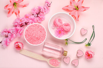 Spa and wellness composition with aromatic rose water, salt, roses and sakura, towels, aromatherapy and skin care, lifestyle concept, invitation and advertising card, selective focus