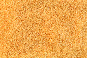 Background made of brown sugar. Crystallized sweetener