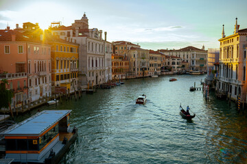 landscape with gondola, motorboat and grand canal