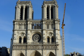 Fototapeta na wymiar The facade of Notre dame de Paris during its renovation on a sunny day. Paris the 29th March 2021.