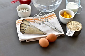 Baking ingredients and kitchen utensils for making healthy gourmet muffins and baked goods. Photo concept, food background, copy space, flay lay, close-up