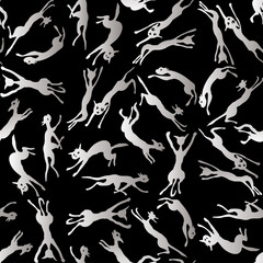 Seamless pattern of silhouettes jumping and running cats