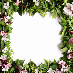 Creative layout with border made of flowers and leaves. Flat lay. Wedding nature concept.