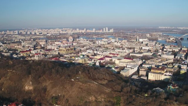 Aerial view of Kiev and landscapes of Dniepr hills, residential neighbourhoods  and business districts. Drone shot. Autumn, the fantastic panorama of Kiev, Ukraine.