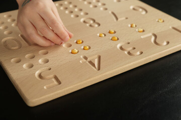 Child's Hand Counting to Four with seeds
