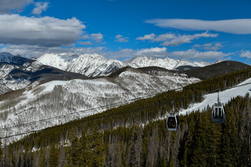 Ski gondola lift with mountains on background. Vail Ski resort in Colorado, USA © FashionStock