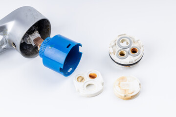 old clogged broken faucet cartridge. handyman repair leaky faucet. water tap fix service concept