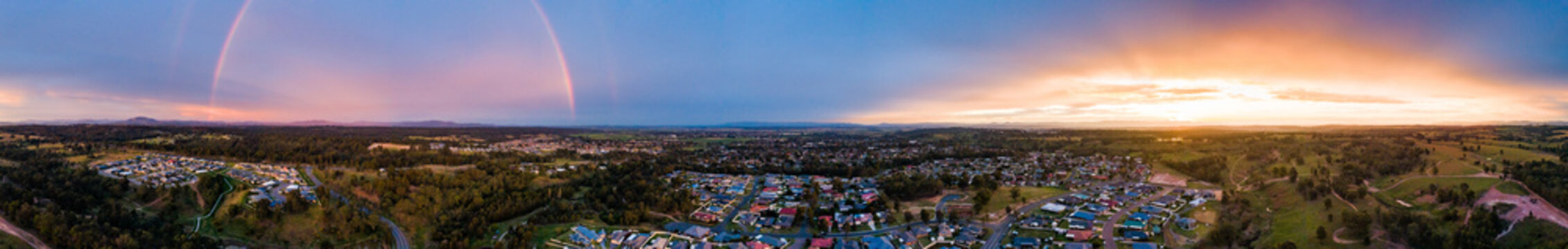 Panorama of rainbow and sunset 180 degrees