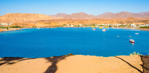 beautiful panoramic views of Sharm El Maya Bay, Hadaba in Sharm El Sheikh, Egypt, South Sinai, with clear blue sea and sun-drenched cliffs