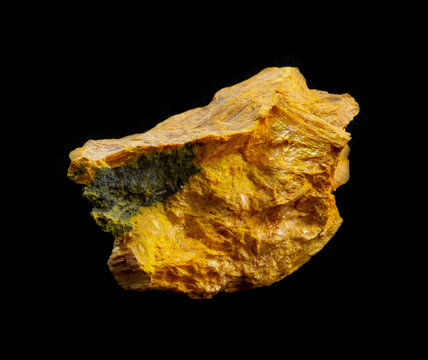 Bright yellow gold orpiment aka auripigmentum mineral from Middle Asia isolated on black background. Geology mineralogy magazines websites article, stone catalog, Natural Science museum wall chart
