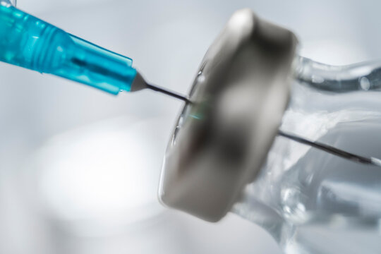 Close-up of Covid-19 vaccine and syringe