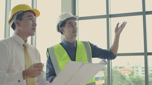 Business concept of 4k Resolution. Engineers are actively planning the work together.