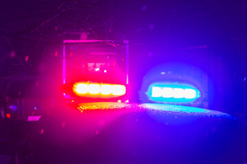 Abstract blurred background with flasher in the dark. Special signals of emergency services....