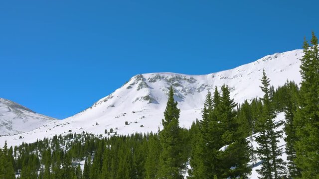 View of the snow-covered mountain peak in the Colorado Rocky Mountains during the winter season