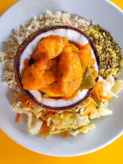 brazilian moqueca top view orange background 