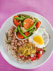 brazilian tipical rice and beans dish top view pink background 