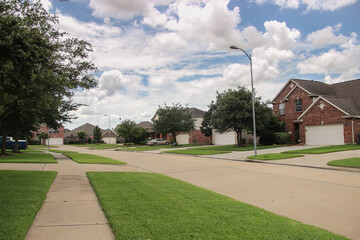 American suburbs. Random street in the neighborhood on a cloudy day.