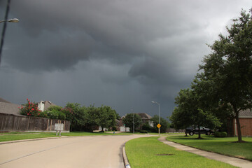 American suburbs. Random street in the neighborhood on a cloudy day.
