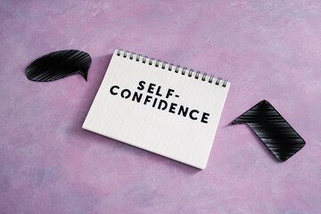 positive attitude concept, Self-confidence text on notepad with comic bubbles of different shape...