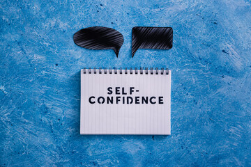 positive attitude concept, Self-confidence text on notepad with comic bubbles of different shape...