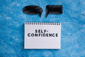 positive attitude concept, Self-confidence text on notepad with comic bubbles of different shape...
