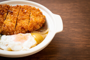 Japanese fried pork cutlet (katsudon) with onion soup and egg