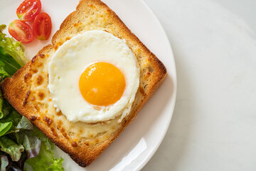 bread toasted with cheese and fried egg