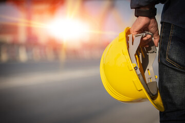 Engineer holding helmet on site Road construction For the development of modern transportation...
