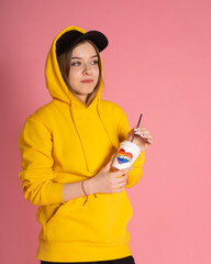 Woman with LGBT rainbow coffee cup