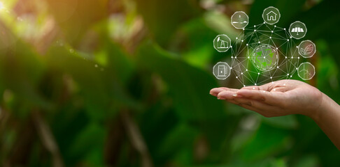 Technology, hand holding with environment Icons over the Network connection on green background.