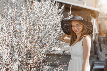a happy woman walks through a flower meadow. Love and spring blooming