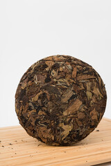Compressed tea cake on white background