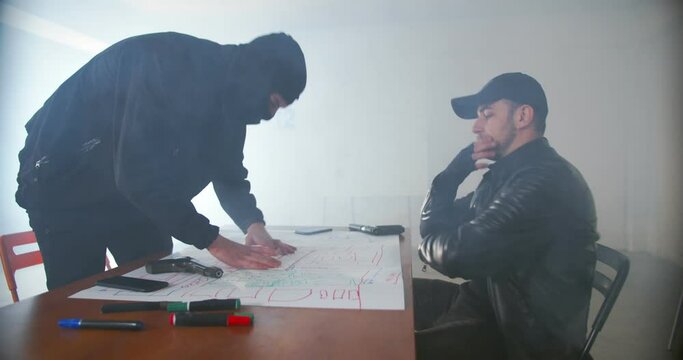 Criminals planning a robbery